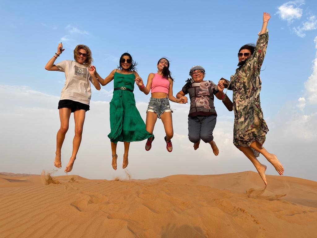 Friends celebrating together in the desert